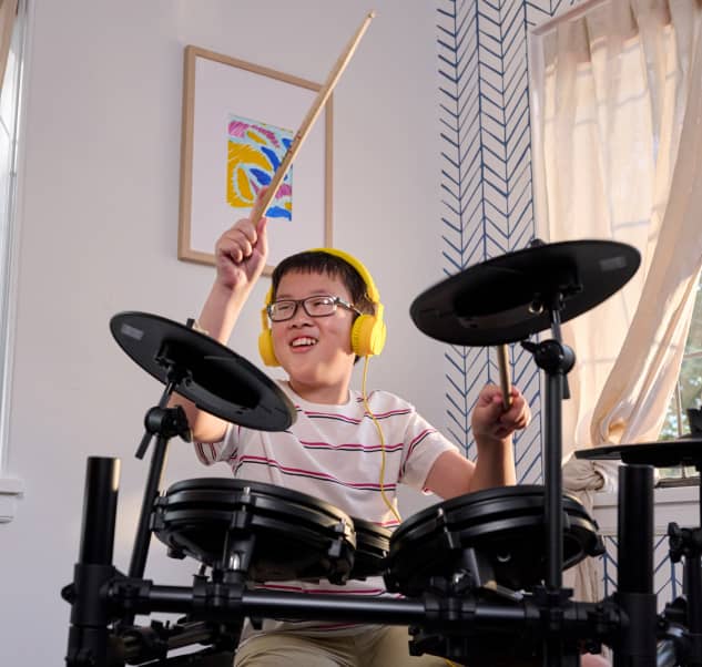 kid playing the drums
